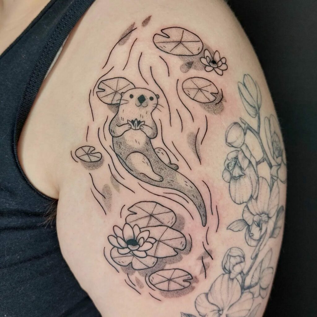 10+ Sea Otter Tattoo Ideas That Will Blow Your Mind! 13 Otter Tattoo in Water With Flowers