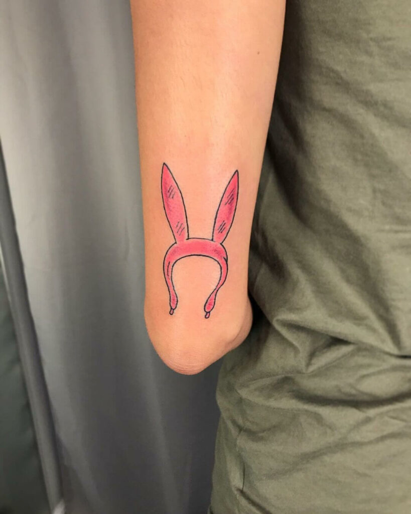 11+ Bunny Ears Tattoo Ideas That Will Blow Your Mind! 11 Pink Bunny Ears Arm Tattoo
