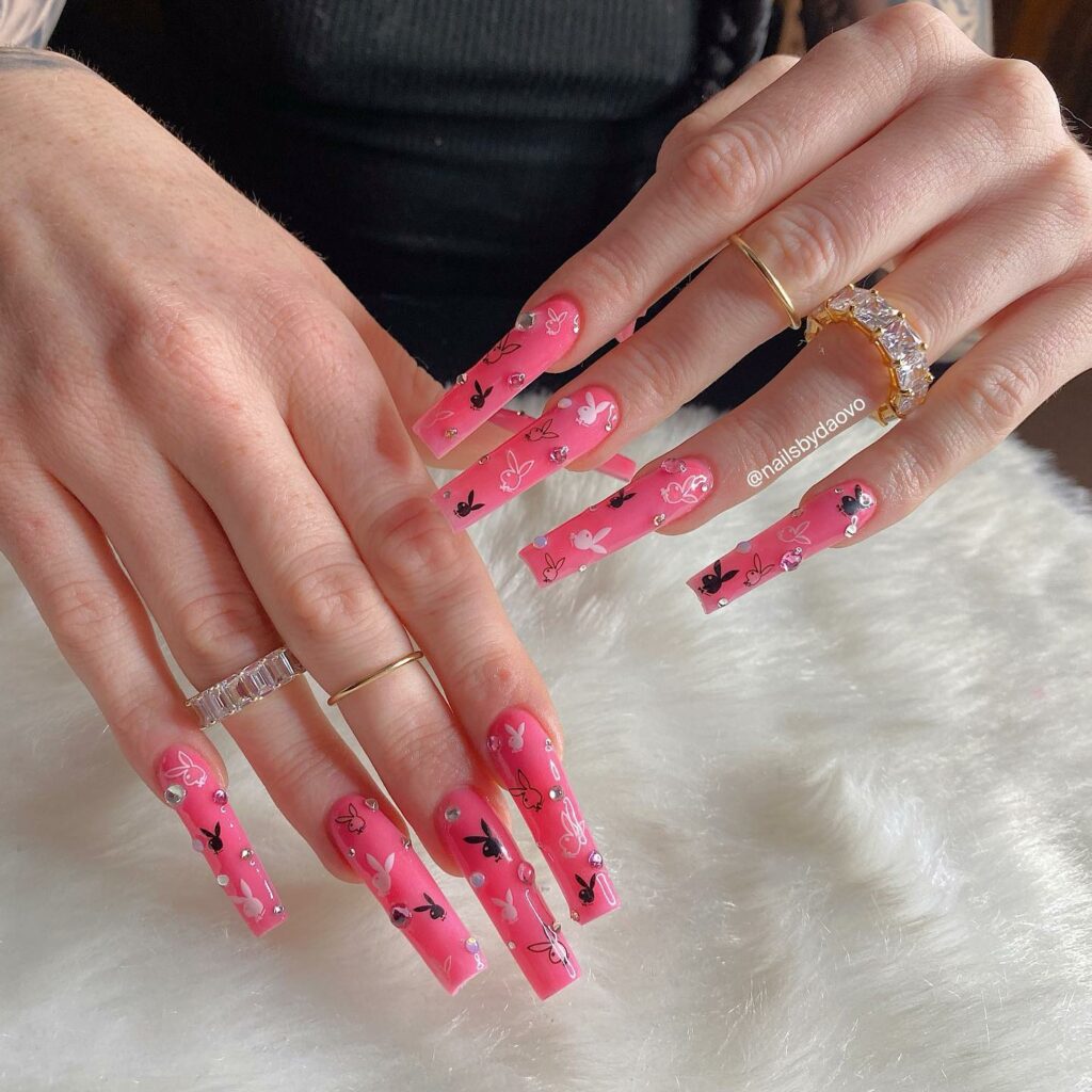 28 Stunning Playboy Nail Designs for 2024 16 Pink Coffin Playboy Nails with Gems Accents