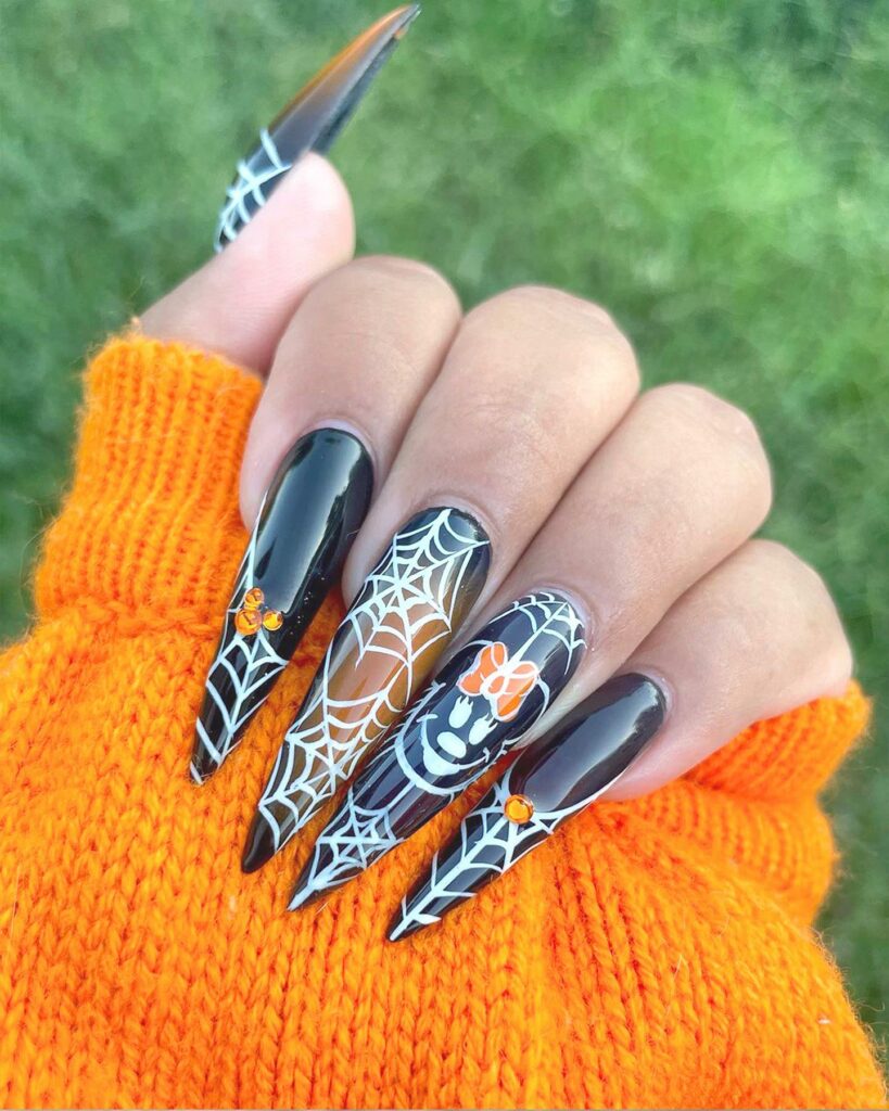 Get Spooky with 33 Black Halloween Nails To Try in 2024 35 Pumpkin spider web nails