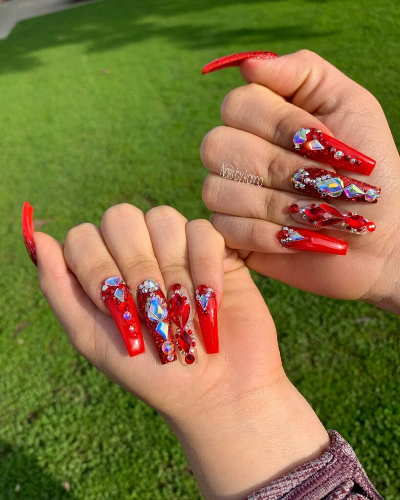 55 Latest Red Nail Ideas To Try In 2024! 41 Acrylic Red Nails Adorned with Rhinestones