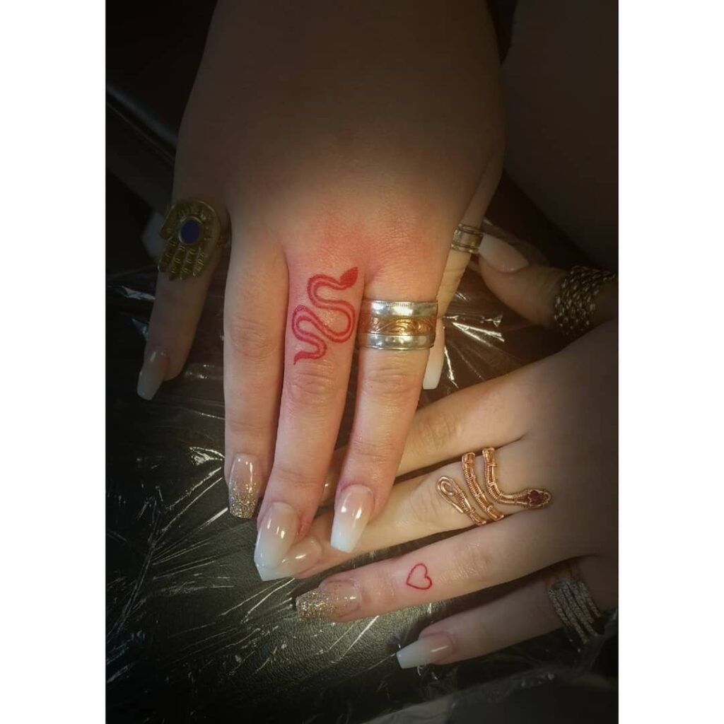 10+ Snake Finger Tattoo Ideas That Will Blow Your Mind! 15 Red Snake Tattoo