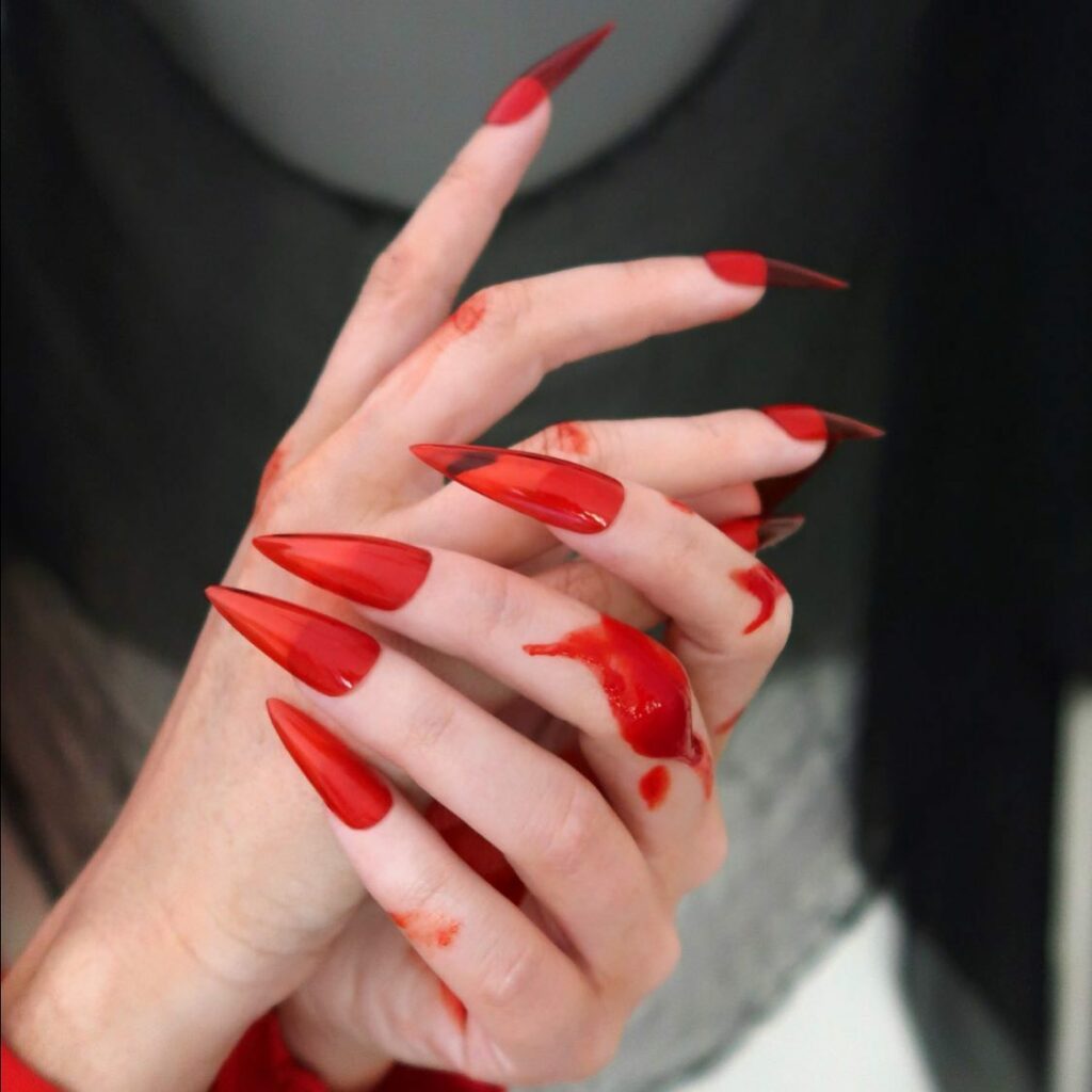 Embrace the Night with 33 Vampire Nail Designs for 2024 10 Red Splatters