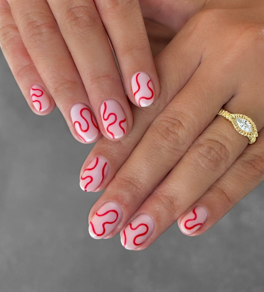 30 Latest Round Nail Designs To Try In 2024! 10 Red Swirls Round Nails