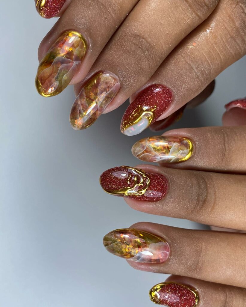 34 Latest Red and Gold Nail Designs To Try In 2024! 23 Red and Gold Foiled Marble Nails
