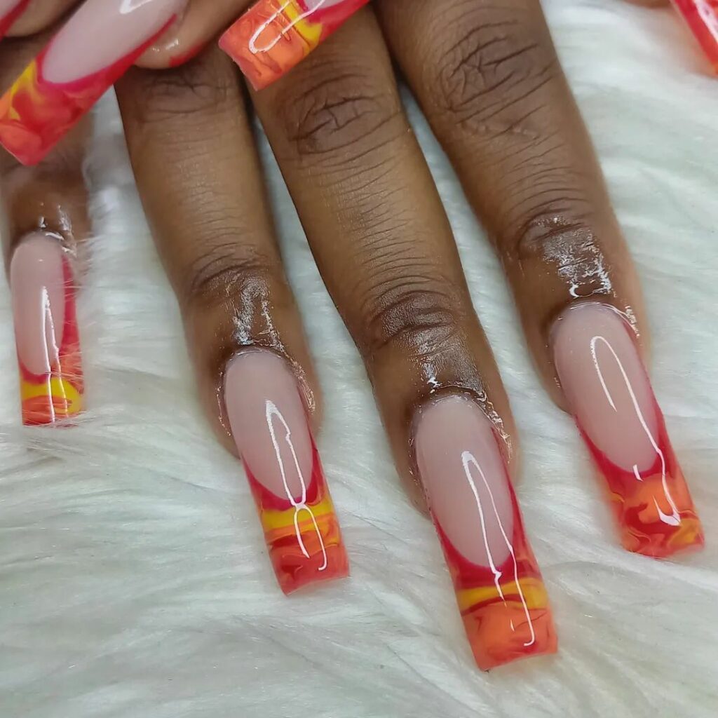Indulge in 40 Marble Nail Designs for 2024 44 Red and Orange Swirls