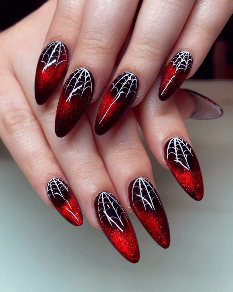 Get Spooky with 33 Black Halloween Nails To Try in 2024 27 Red spider web nails