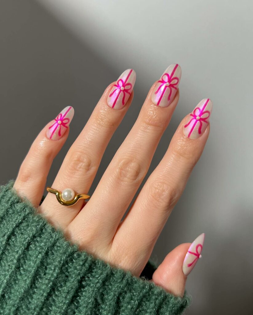 Get Merry with 30 Pink Christmas Nail Ideas in 2024 13 Ribbon-Inspired Pink Christmas Nails