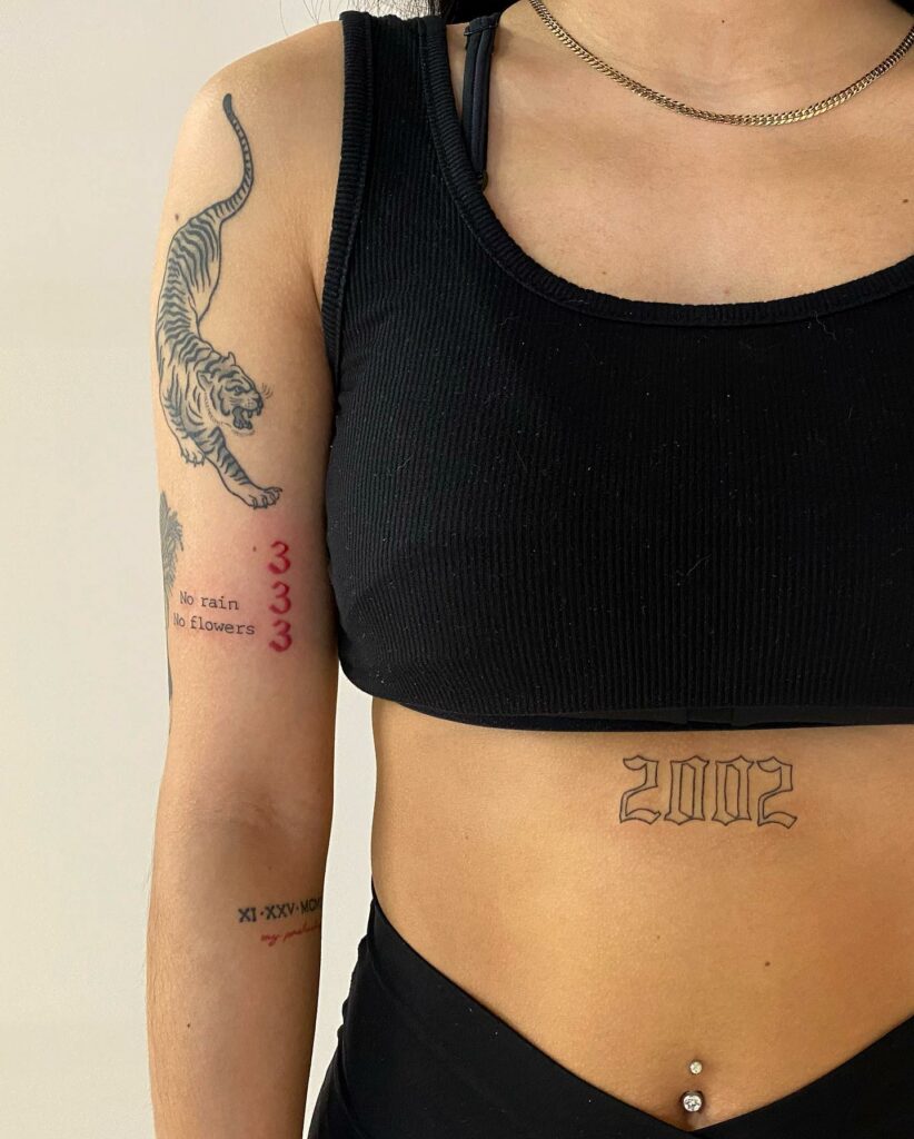 10 Birth Year Tattoo Ideas for 2024 15 Ribcage Birth Year Tattoo