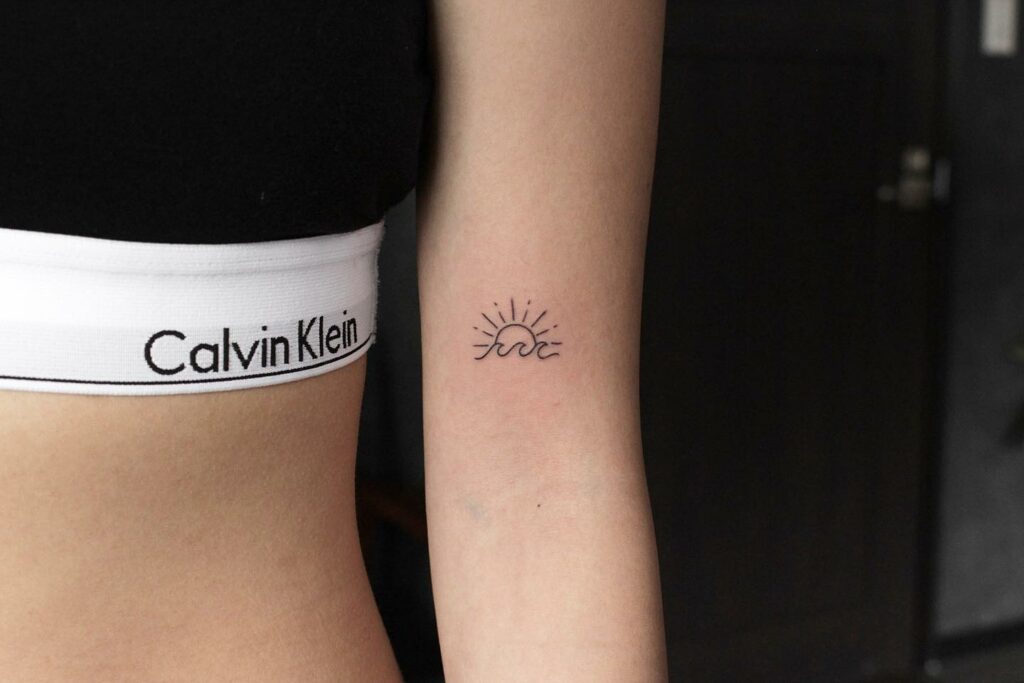 10+ Small Sun Tattoo Designs That Will Blow Your Mind! 20 Rising Sun Over Waves Tattoo