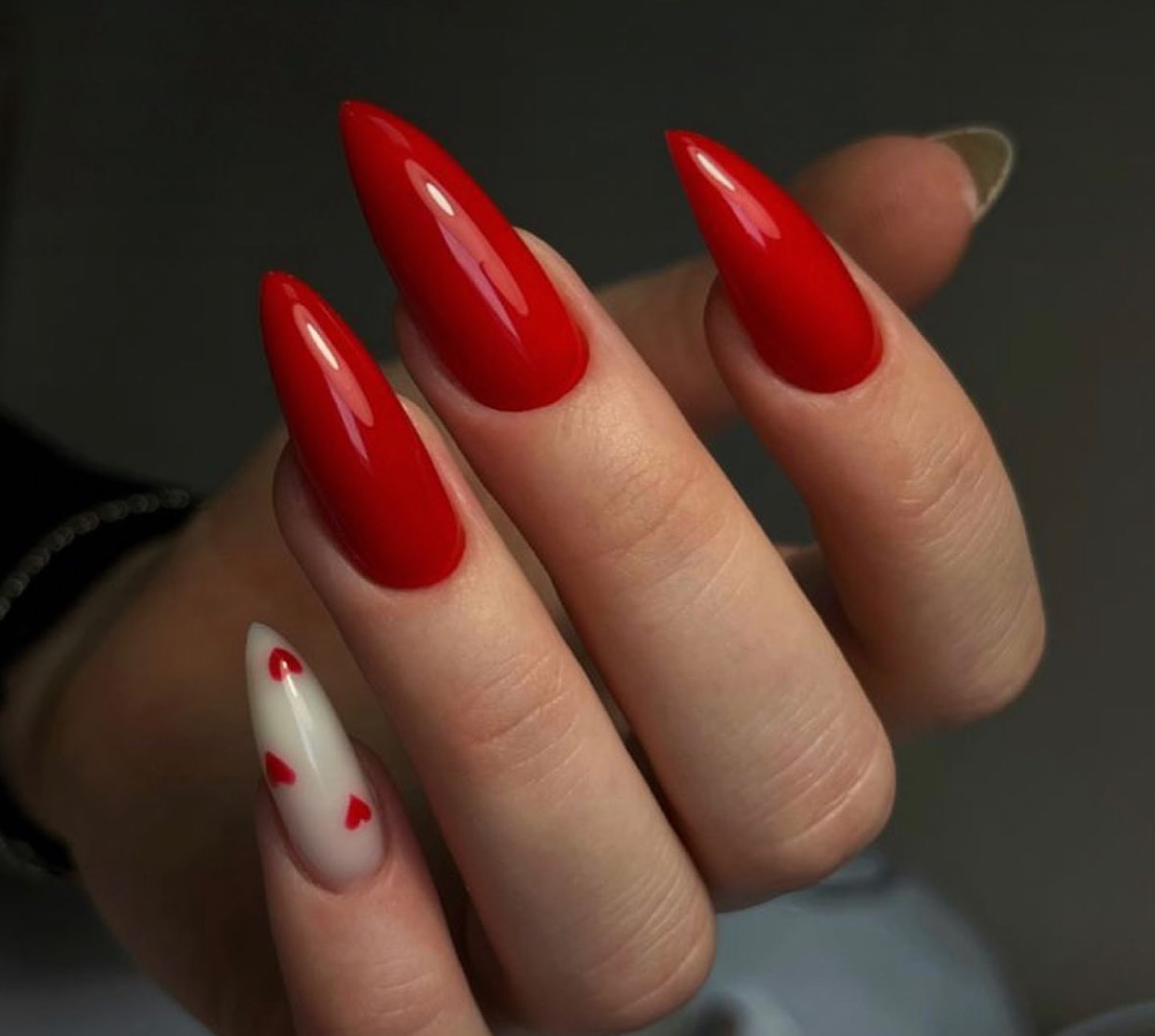 20 Latest Red Nail Designs To Try Today ✨ 13 Romantic Red Stilettos with Sweet Heart Accents