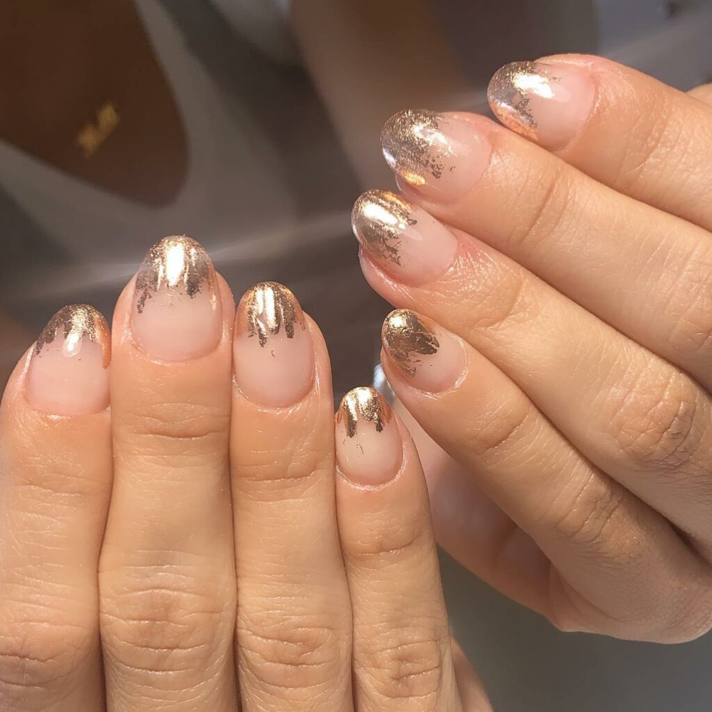 Shine Bright with 50 Rose Gold Nail Designs for 2024 56 Rose Gold Foil