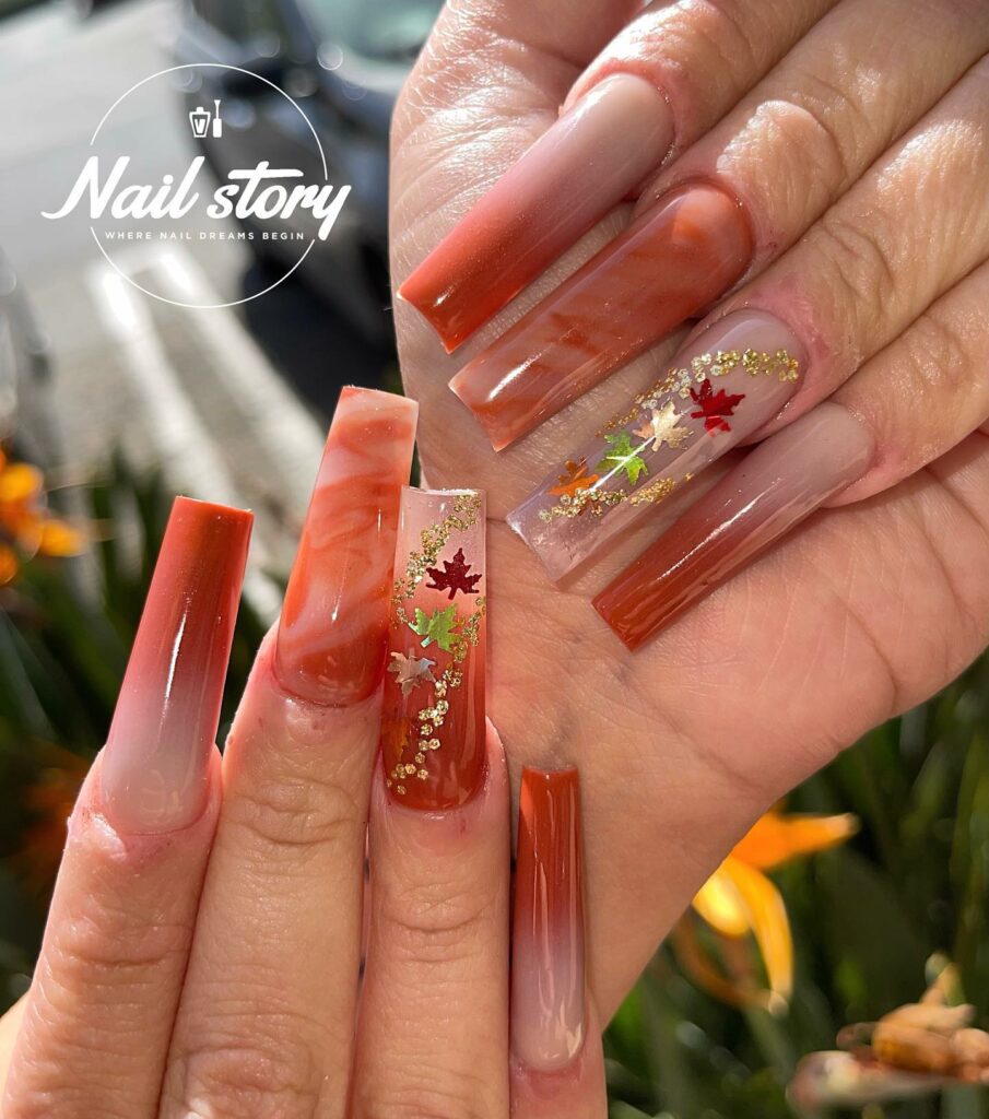 33 Latest Orange Acrylic Nail Ideas To Try in 2024! 40 Ethereal Blooms on Marble Orange Acrylic Nails