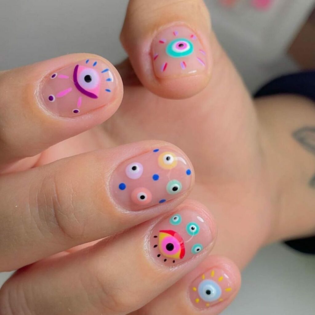Channel Mystique with 20 Evil-Eye Nail Designs for 2024 29 Sepia evil eye nails
