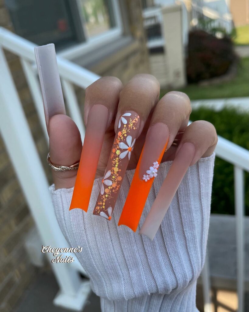 33 Latest Orange Acrylic Nail Ideas To Try in 2024! 11 Serene Daisies Orange Acrylic Nails