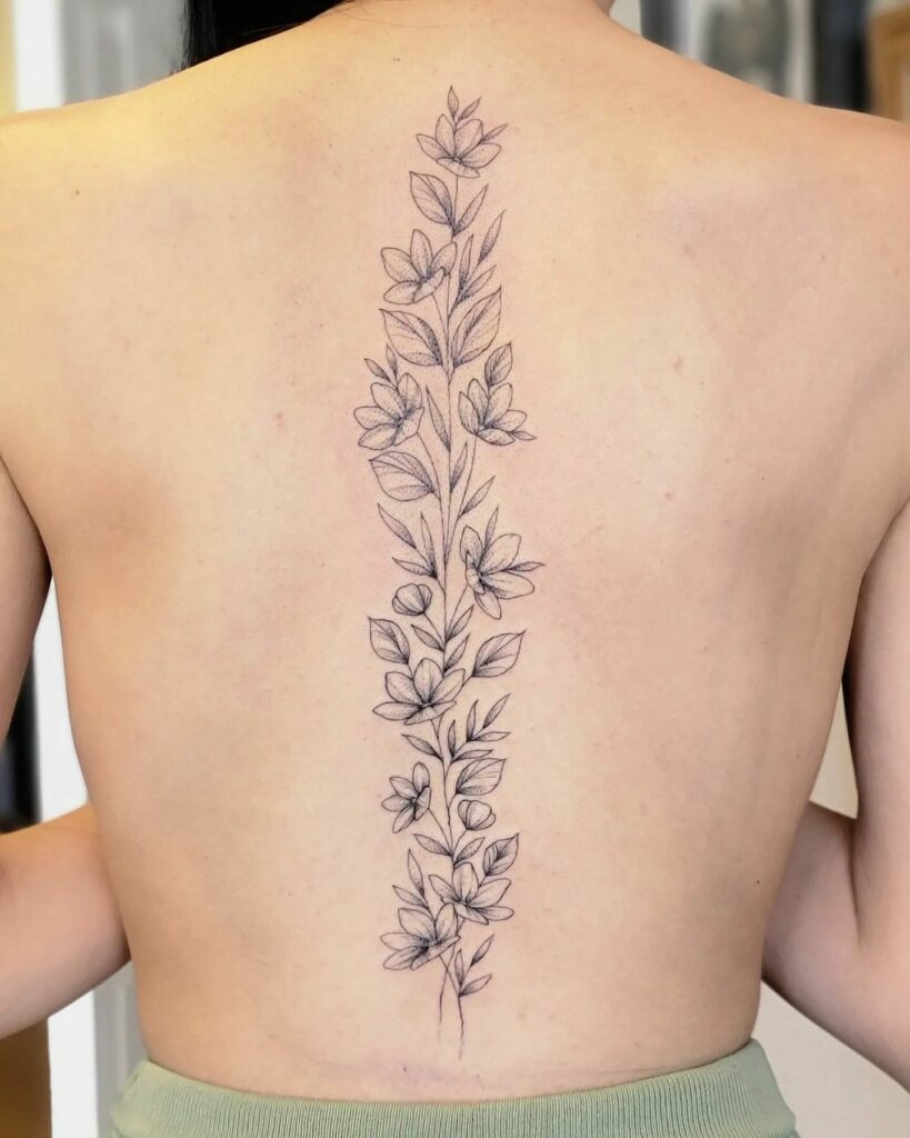 11+ Flower Spine Tattoo Ideas That Will Blow Your Mind! 13 Shaded Floral And Leaf Spine Tattoos For Women