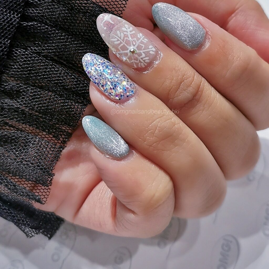 Get Cozy with 20 Grey Christmas Nail Ideas in 2024 24 Shimmering Grey Christmas Nails with Silver Flakes