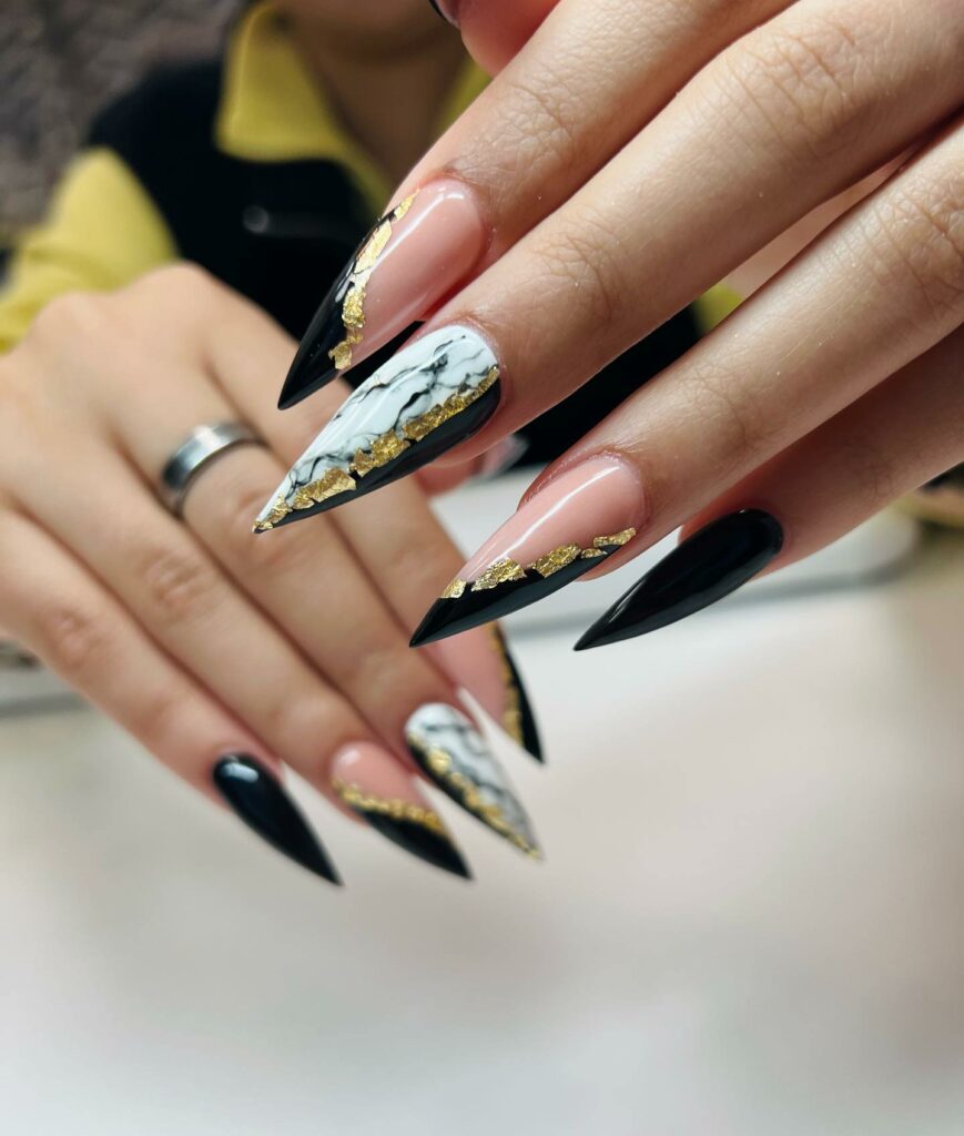 40 Latest Black Stiletto Nail Ideas To Try In 2024! 29 Marble Black and White Nails with Gold Foil