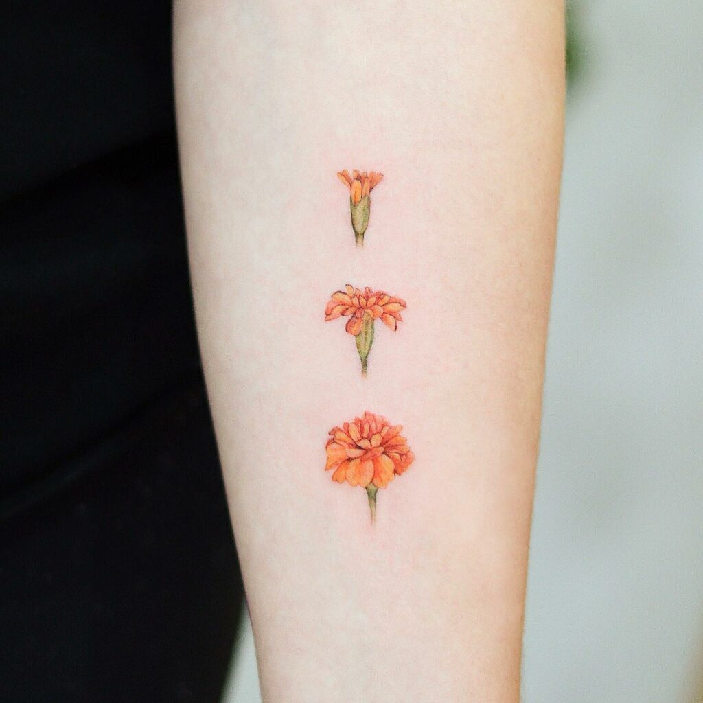 11+ October Birth Flower Tattoo Ideas That Will Blow Your Mind! 11 Simple And Minimal Marigold Flower Tattoo Ideas