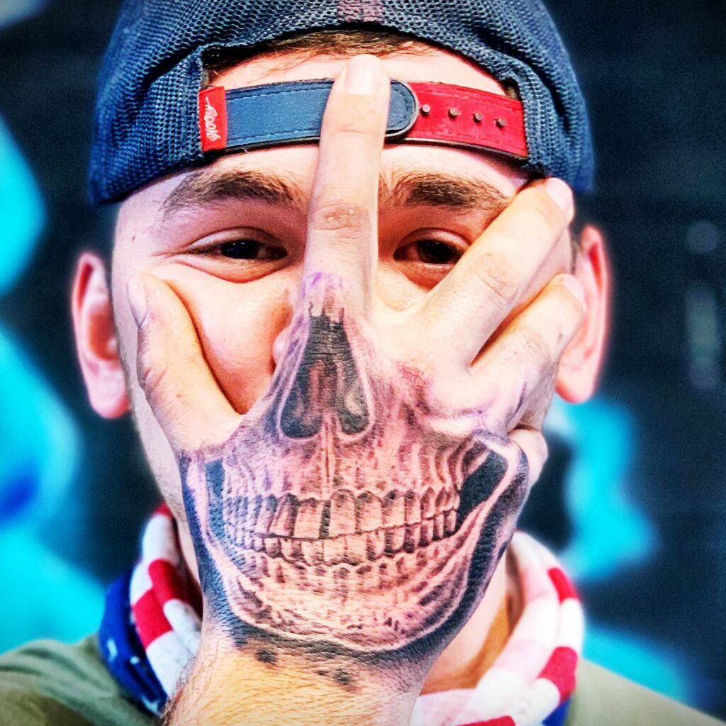 34 Hand Skeleton Tattoo Designs for 2024 32 Skeleton Face Hand Tattoo