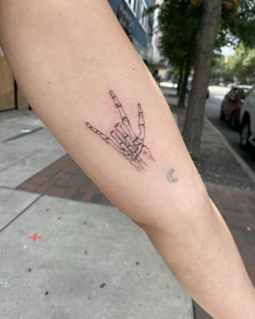34 Hand Skeleton Tattoo Designs for 2024 21 Skeleton Hand Tattoo For Music Aficionados
