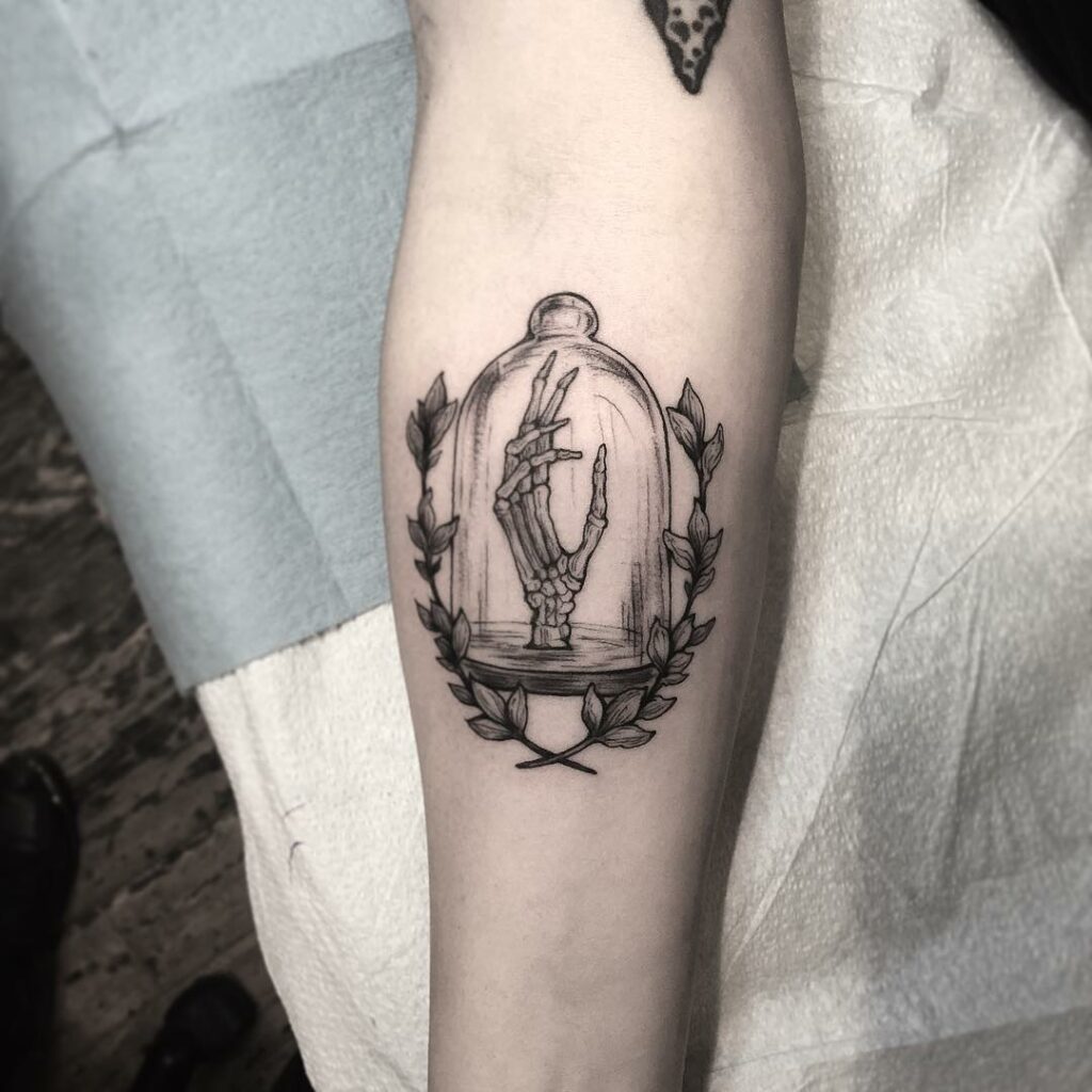 34 Hand Skeleton Tattoo Designs for 2024 20 Skeleton Hand Tattoo In A Bell Jar
