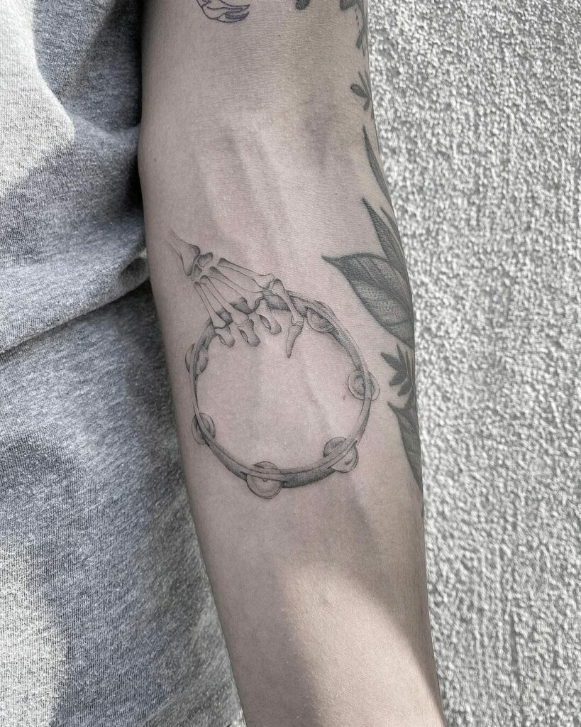 34 Hand Skeleton Tattoo Designs for 2024 22 Skeleton Hand with Tambourine