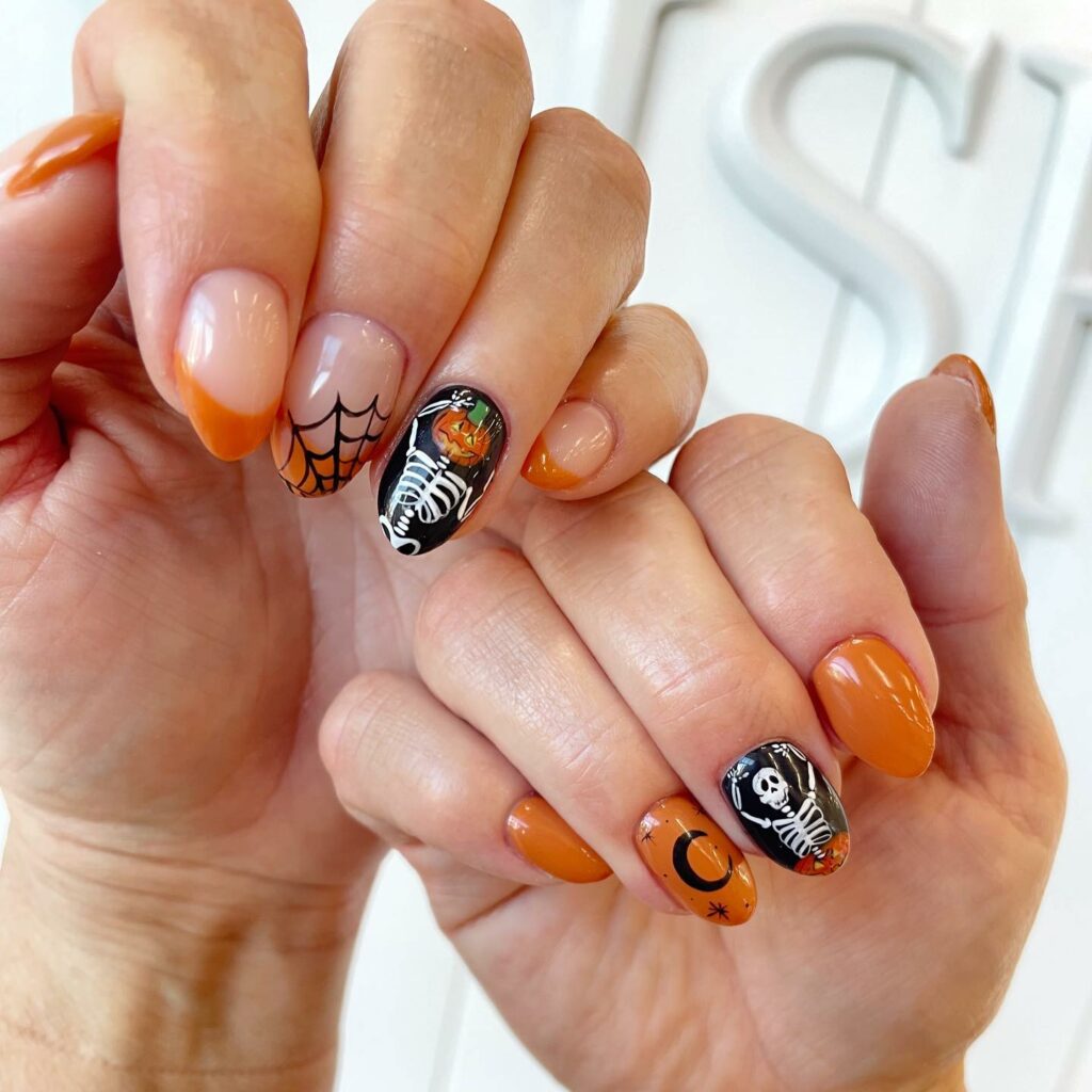 26 Latest Pumpkin Nail Designs To Try This Halloween 20 Skeleton Pumpkin Nails