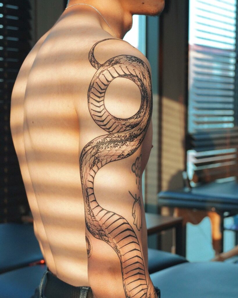 11+ Back Of Bicep Tattoo Ideas That Will Blow Your Mind! 17 Snake Back Of The Bicep Tattoo