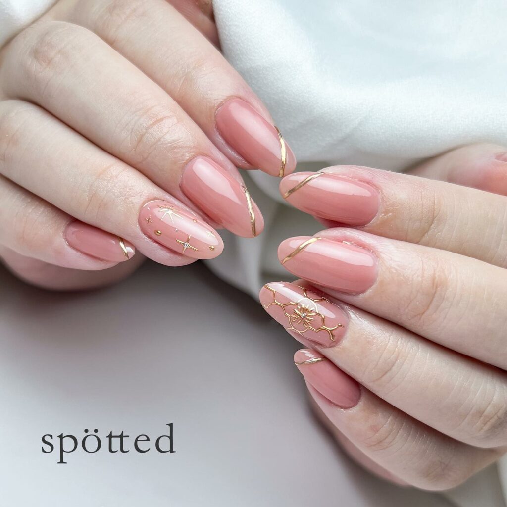 Shine Bright with 50 Rose Gold Nail Designs for 2024 53 Speckled Rose Gold