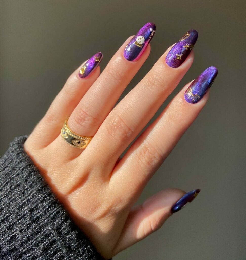 20 Latest Purple And Gold Nail Ideas To Try In 2024! 11 Dark Purple Almond Nails With Gold Star Design