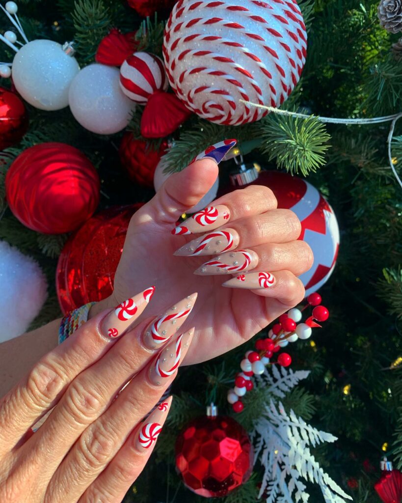 Enjoy 20 Candy Cane Nail Designs in 2024 18 Stiletto Candy Cane Nail Art Adorned with Pearls