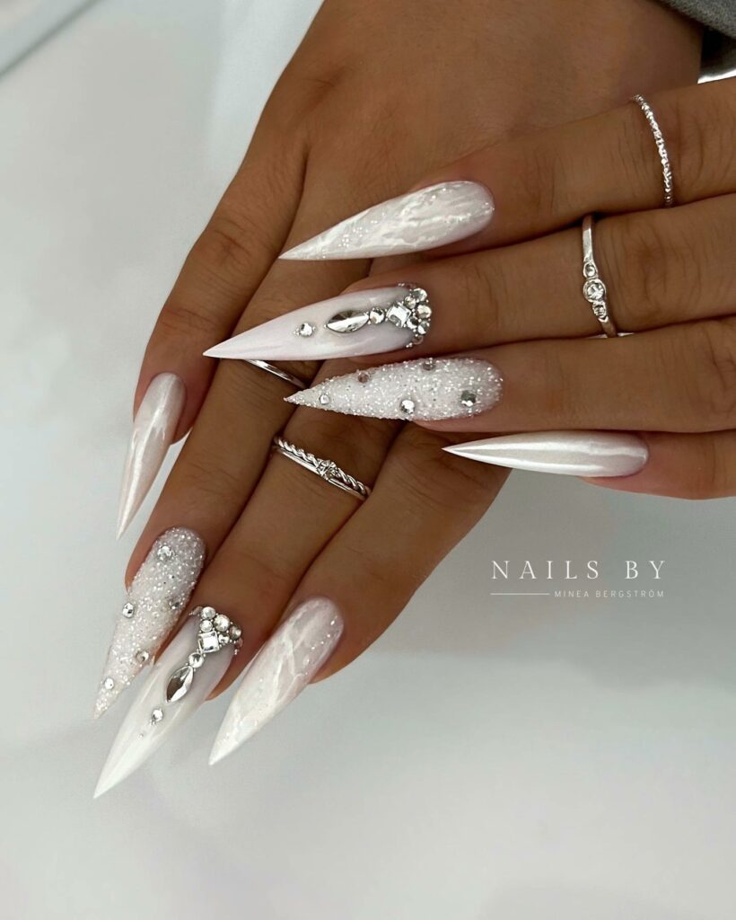 Get Festive with 20 Stiletto Christmas Nail Ideas in 2024 10 Stiletto White Christmas Nails with Gems