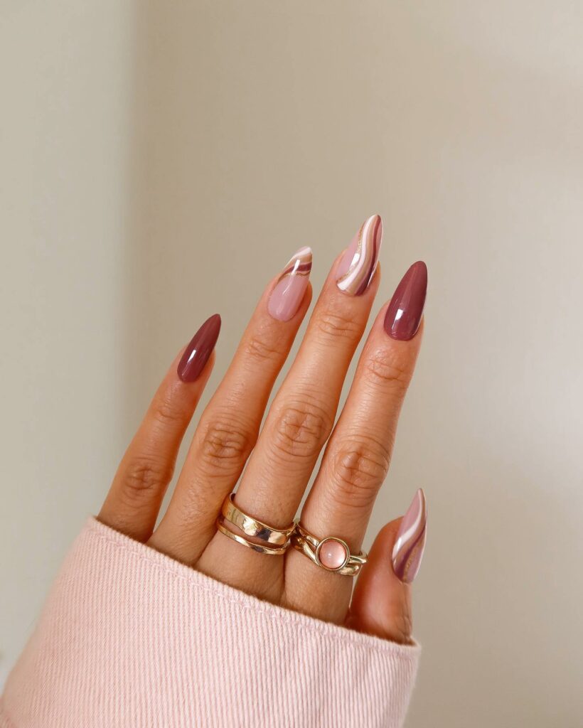 27 Latest Maroon Nail Designs To Try In 2024! 15 Artful Swirl Maroon Nails