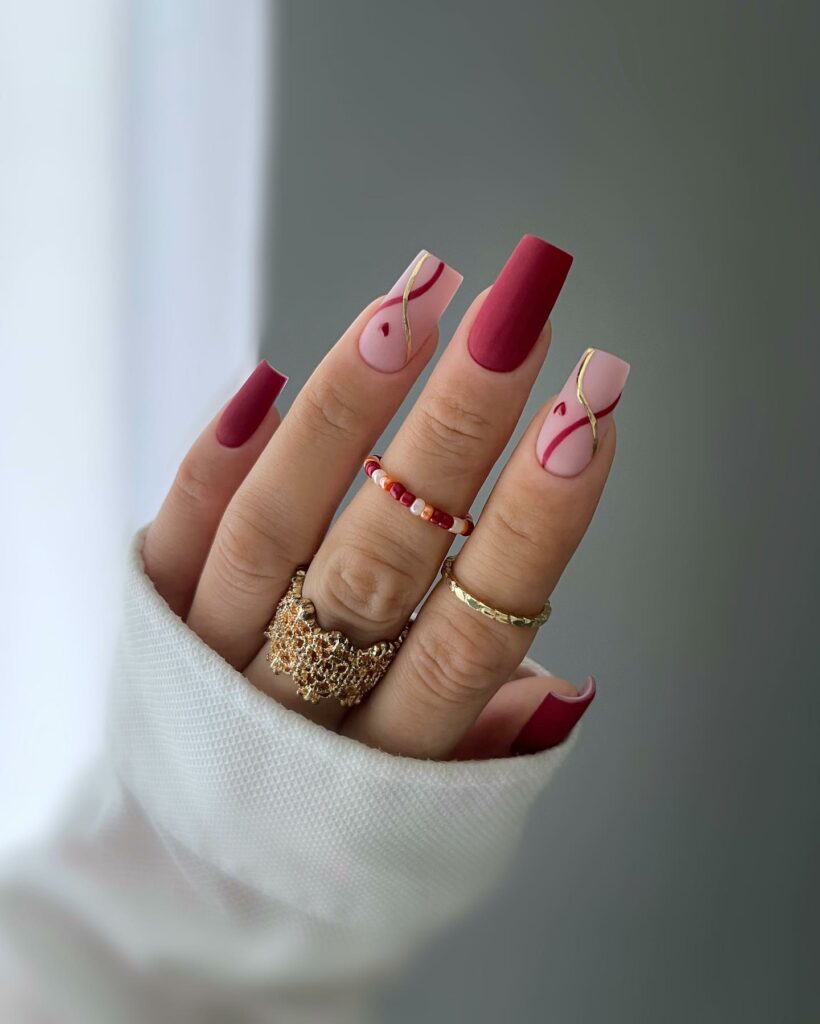Shine Bright with 30 Red and Gold Christmas Nail Ideas in 2024 18 Swirl Red and Gold Christmas Nails