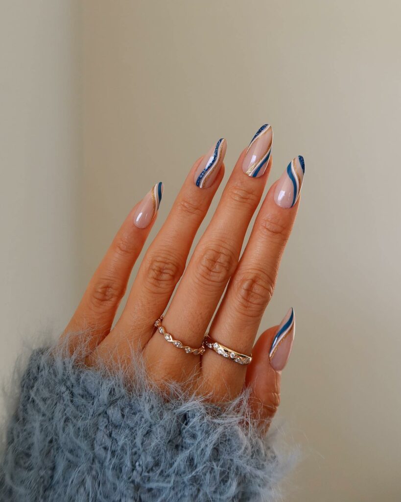 Feel Festive with 30 Blue Christmas Nail Ideas in 2024 28 Swirly Blue Christmas Nails