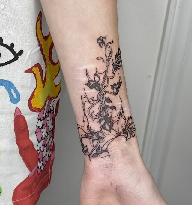 10+ Vine Flower Tattoo Ideas That Will Blow Your Mind! 15 Tangled Flower Vine Tattoo on Arm