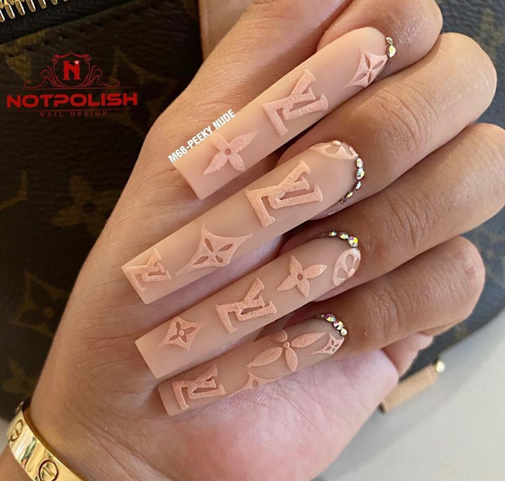 25 Latest Louis Vuitton Nails To Try In 2024 22 Textured Acrylic Ombré Nails with Louis Vuitton