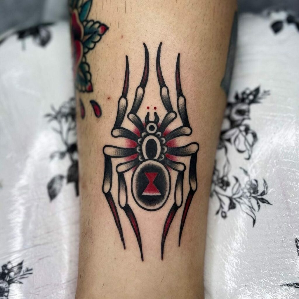 11+ Traditional Black Widow Tattoo Ideas That Will Blow Your Mind! 15 The Black Widow Tattoo with Red Hourglass Design