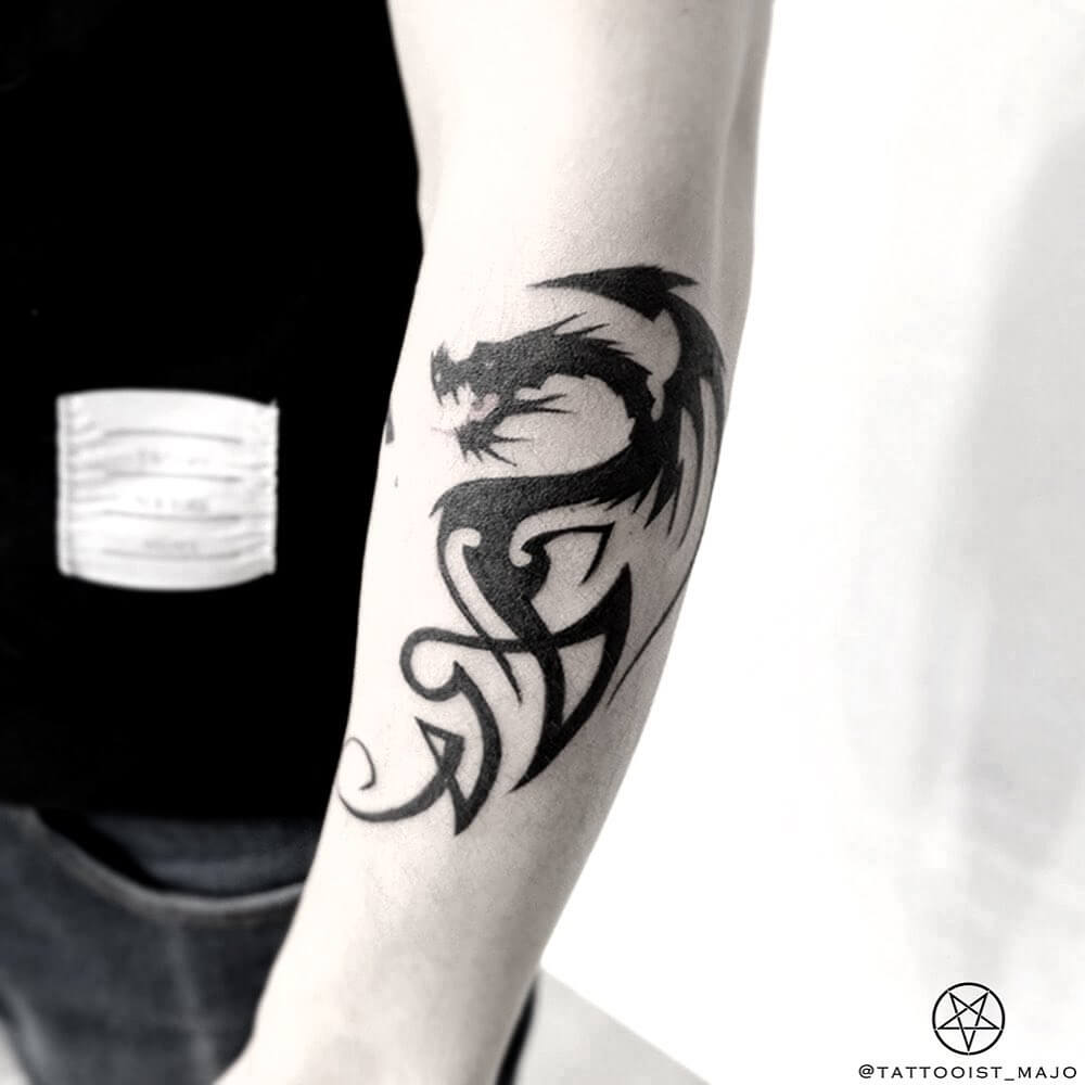 11+ Tribal Dragon Tattoo Ideas You Have To See To Believe! 12 The Dragon King Tattoo