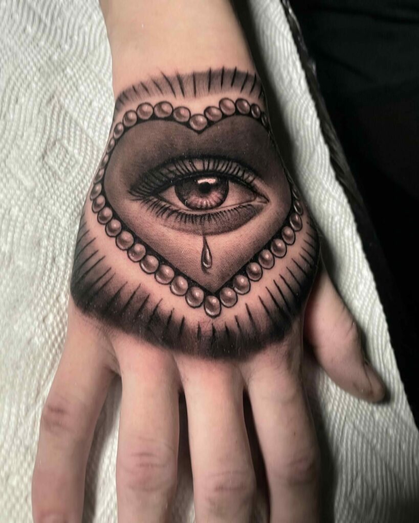 19+ Women's Hand Tattoo Ideas To Inspire You! 22 The Heart Tattoo For The Lovelorn's Anguish