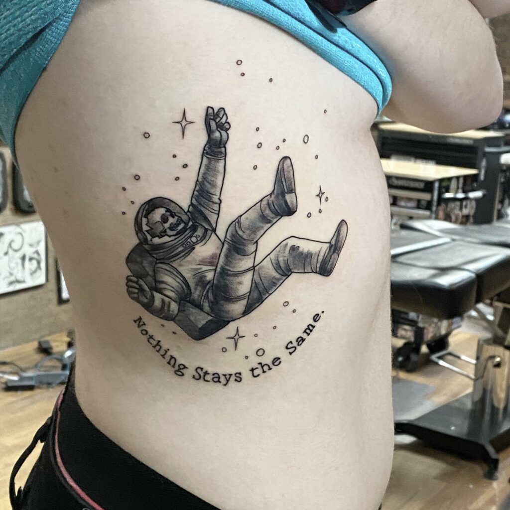10+ Simple Astronaut Tattoo Ideas That Will Blow Your Mind! 16 The Skull Tattoo With The Dead Body Floating