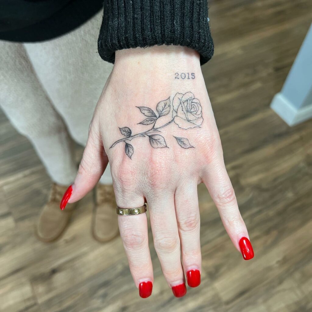 19+ Women's Hand Tattoo Ideas To Inspire You! 13 The Subtle Rose Tattoo Style