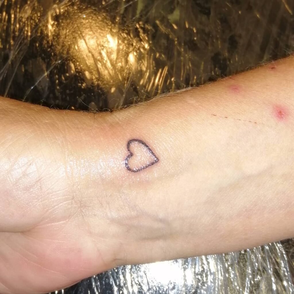 11+ Outline Heart Tattoo Ideas That Will Blow Your Mind! 13 Tiny Heart Tattoo On Wrist