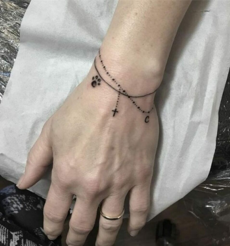 10+ Wrist Cross Tattoo Ideas That Will Blow Your Mind! 19 Tiny Rosary Tattoo