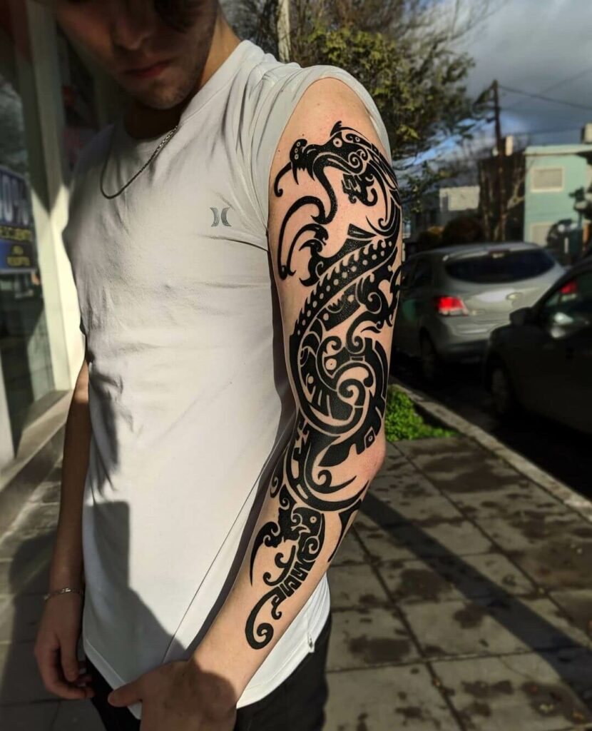 11+ Tribal Dragon Tattoo Ideas You Have To See To Believe! 11 Tribal Dragon Tattoo On Arm