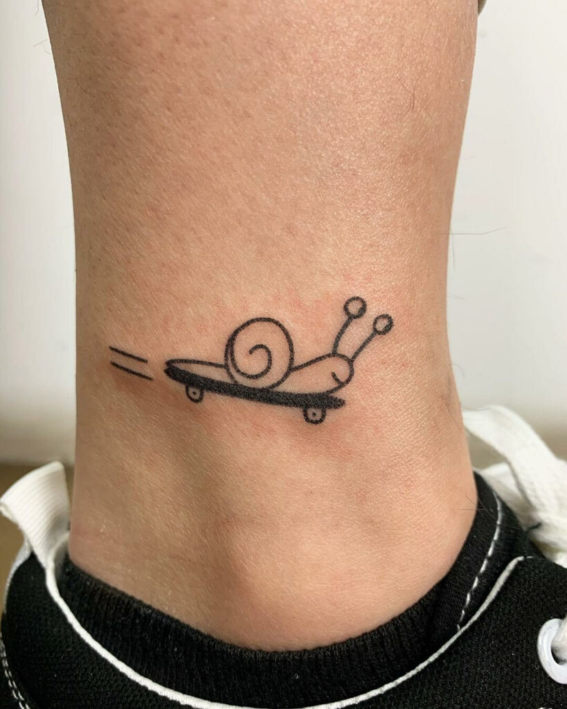 10+ Snail Tattoo Ideas You Have To See To Believe! 19 Turbo Snail Tattoo Design On Skateboard