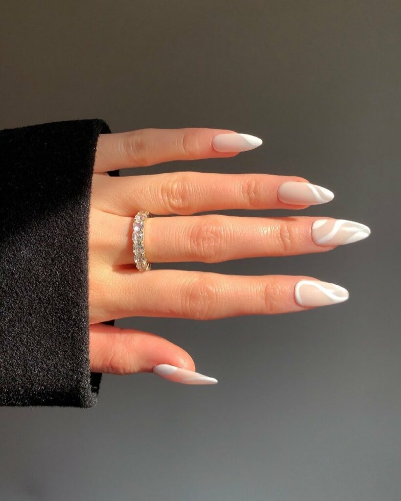 50 Latest Almond Shape Nail Ideas To Try In 2024! 26 White Swirl Almond Nails