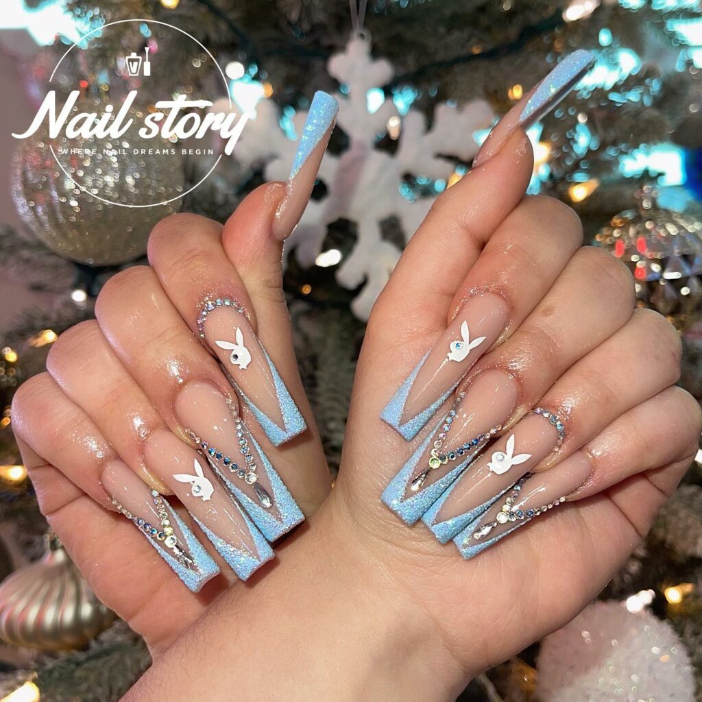 28 Stunning Playboy Nail Designs for 2024 34 White Playboy Nails with Blue V French Tips