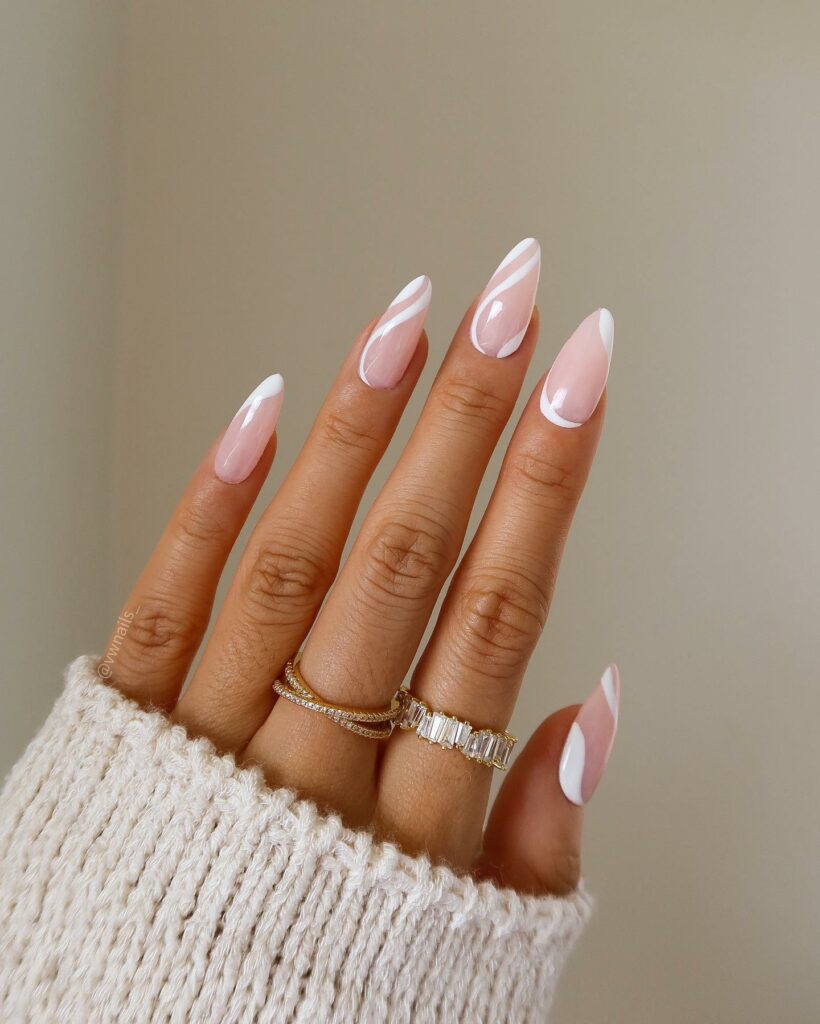 Rock 25 Chic White Almond Nail Designs in 2024 22 White Almond Nails with Swirling Patterns